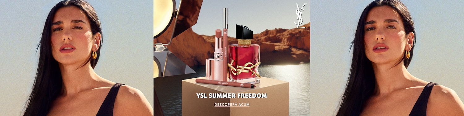 Femeie cu păr lung închis la culoare și cercei aurii, fotografiată în lumină naturală. În centru sunt prezentate produse de frumusețe și un parfum Yves Saint Laurent, pe fundal cu peisaj stâncos. Text: «YSL Summer Freedom».